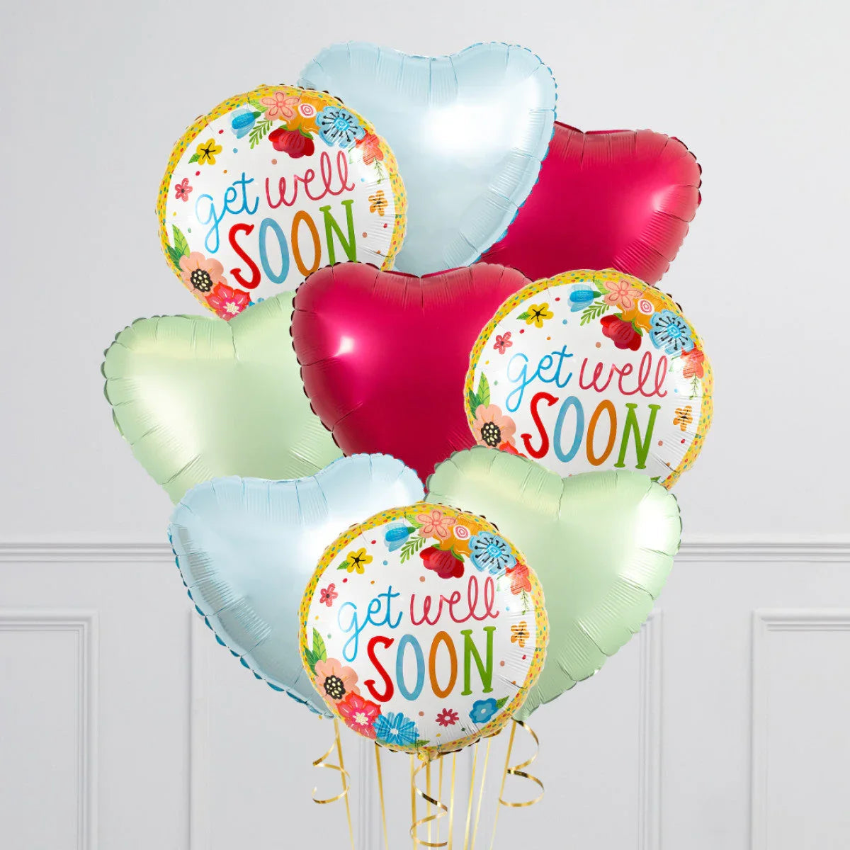 Colorful get well soon balloons with floral designs and heart-shaped balloons in pastel colors