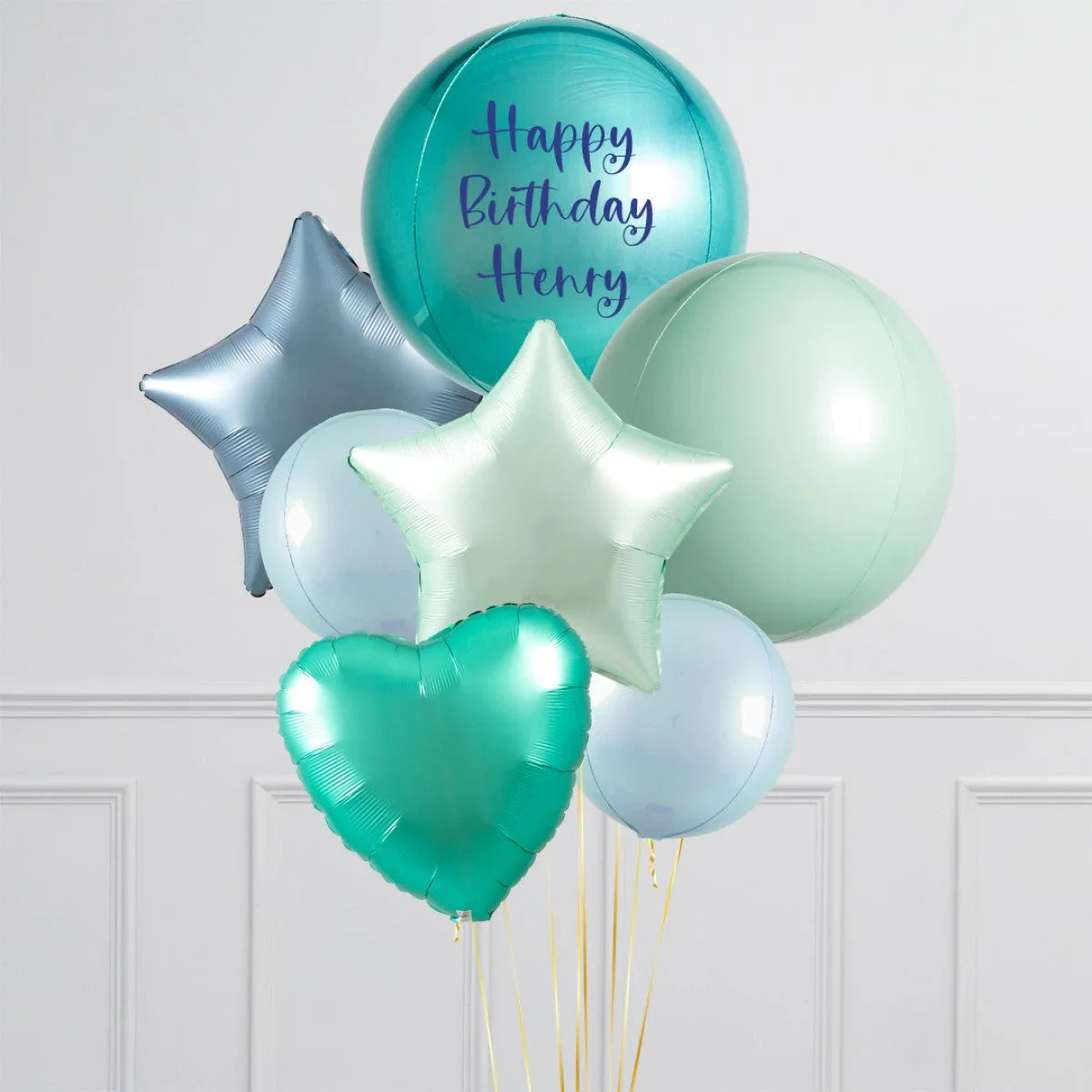 Personalised blue lagoon birthday balloons with stars, heart shapes, and Happy Birthday Henry text
