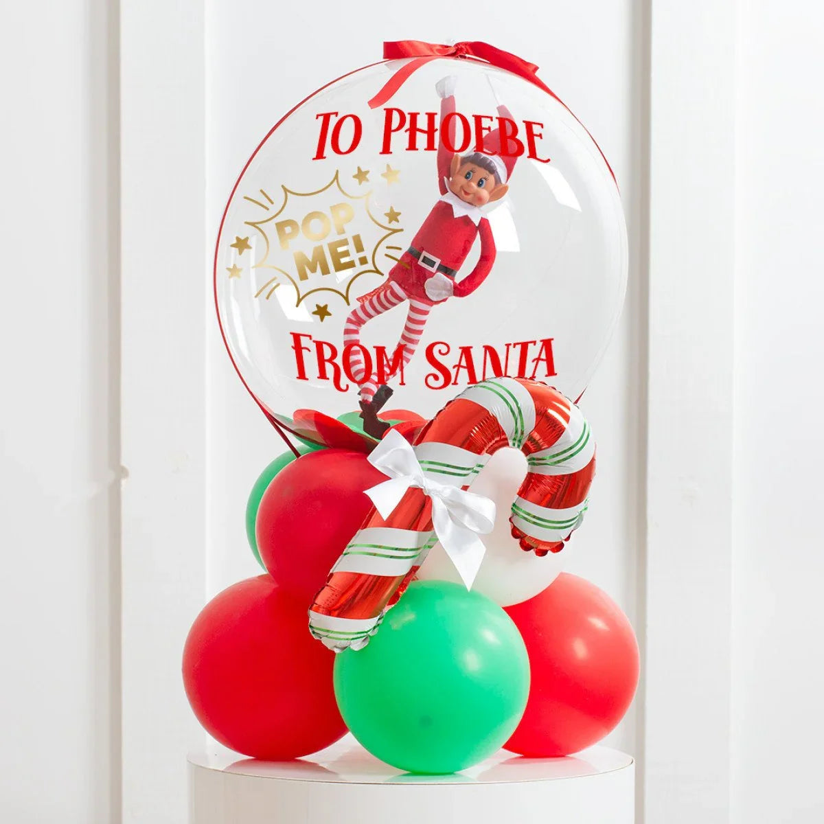 Christmas balloon gift with elf inside clear bubble, red and green balloons, candy cane, personalized to Phoebe from Santa