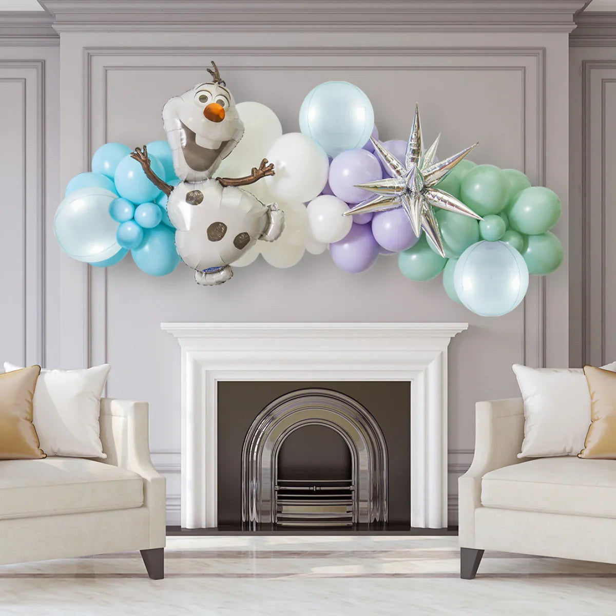 Colorful balloon garland with Olaf foil balloon and star decoration above modern white fireplace