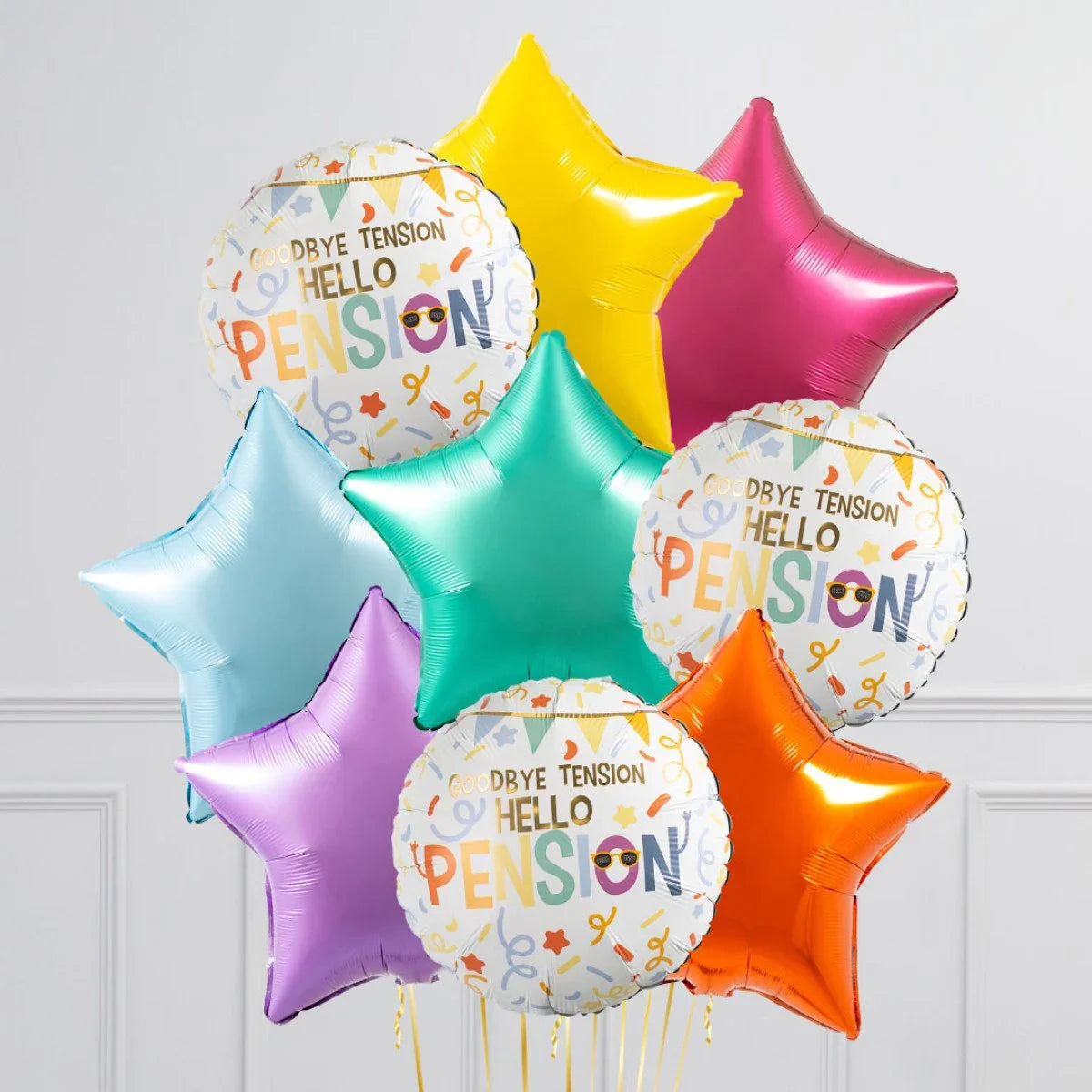 Colorful inflated foil retirement balloons with 'Goodbye tension Hello Pension' and bright star shapes