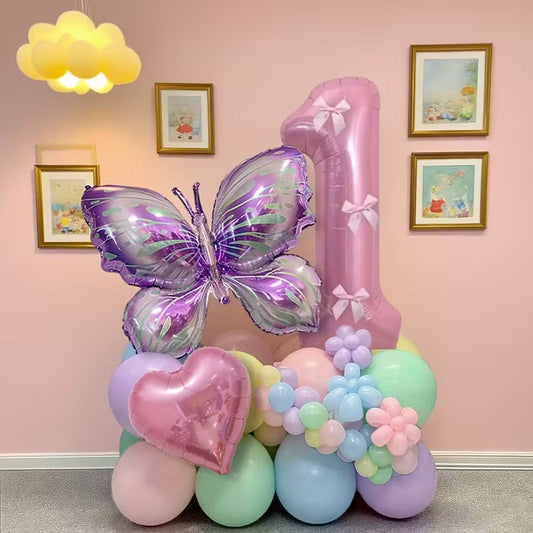 Pink number 1 balloon stand with purple butterfly and heart-shaped foil balloons on pastel balloon base