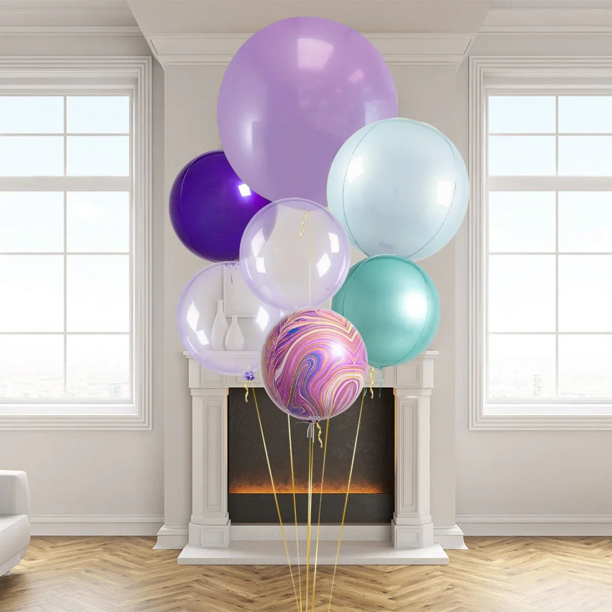 Colorful giant balloon bunch in pastel shades including purple, teal, and marbled design in a modern room