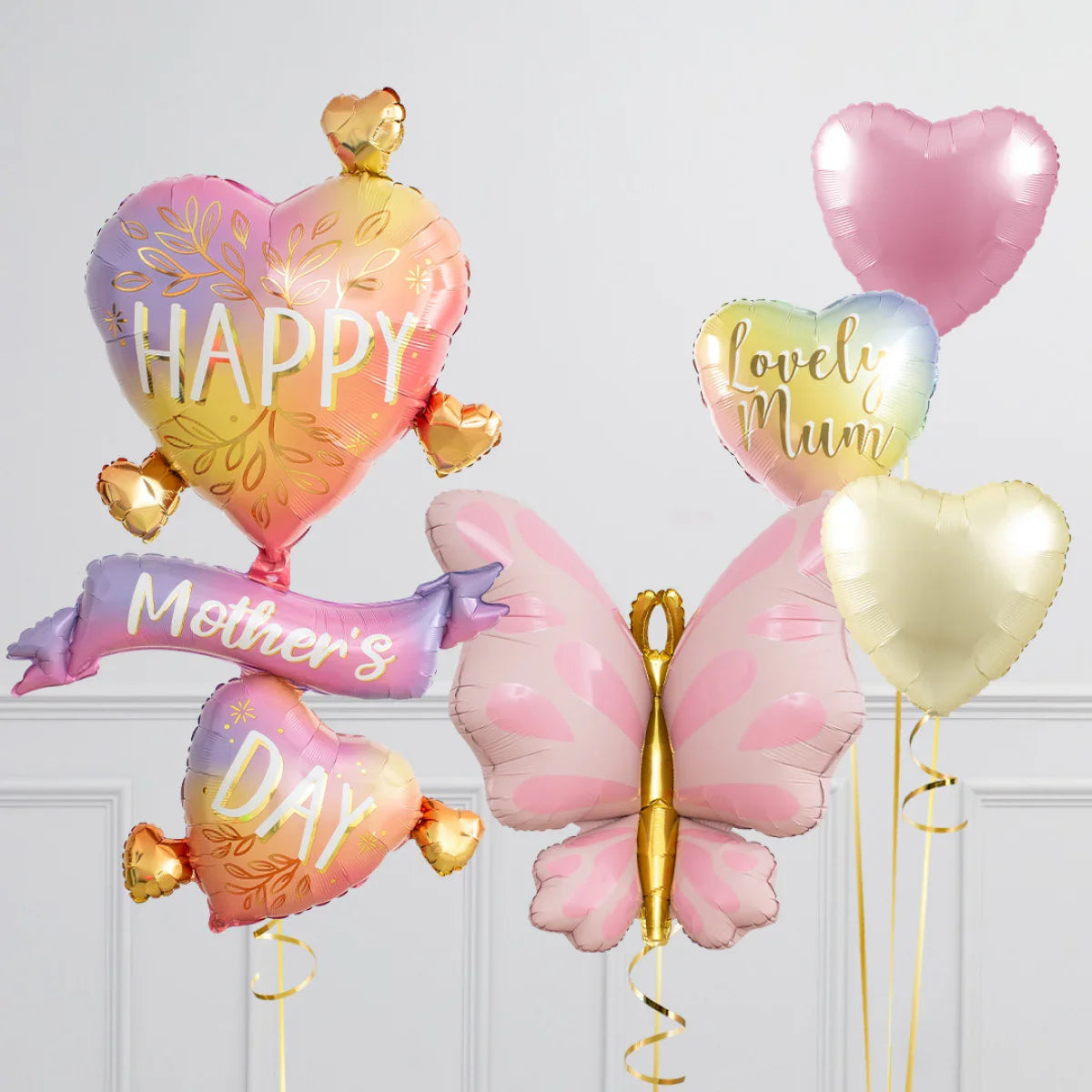 Colorful Mother's Day balloons including heart shapes and a pink butterfly balloon