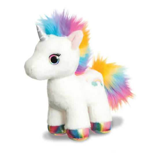 White plush unicorn toy with rainbow mane, tail, hooves, and silver horn on white background
