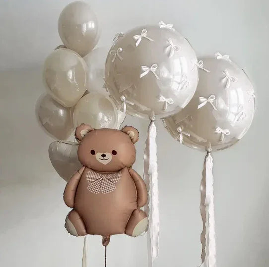 Brown teddy bear balloon with checkered bow and transparent balloons decorated with white bows