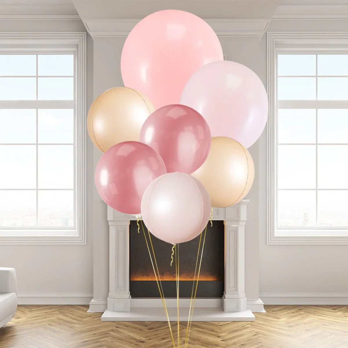 Cluster of pink, rose gold, and cream balloons in a modern living room with a fireplace