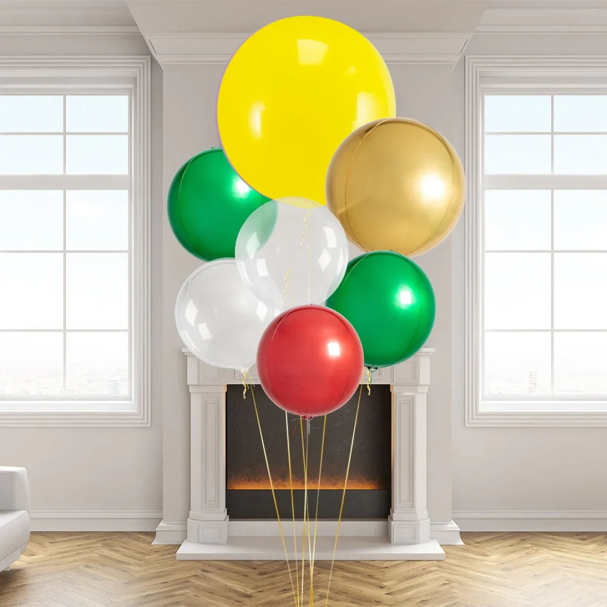 Colorful giant round balloons in yellow, gold, green, white, and red inside a modern living room with a fireplace and large windows
