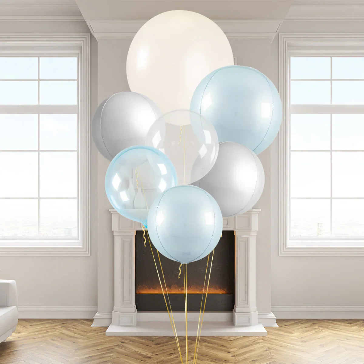 Cluster of large pastel blue, white, silver, and clear balloons in a modern living room with fireplace