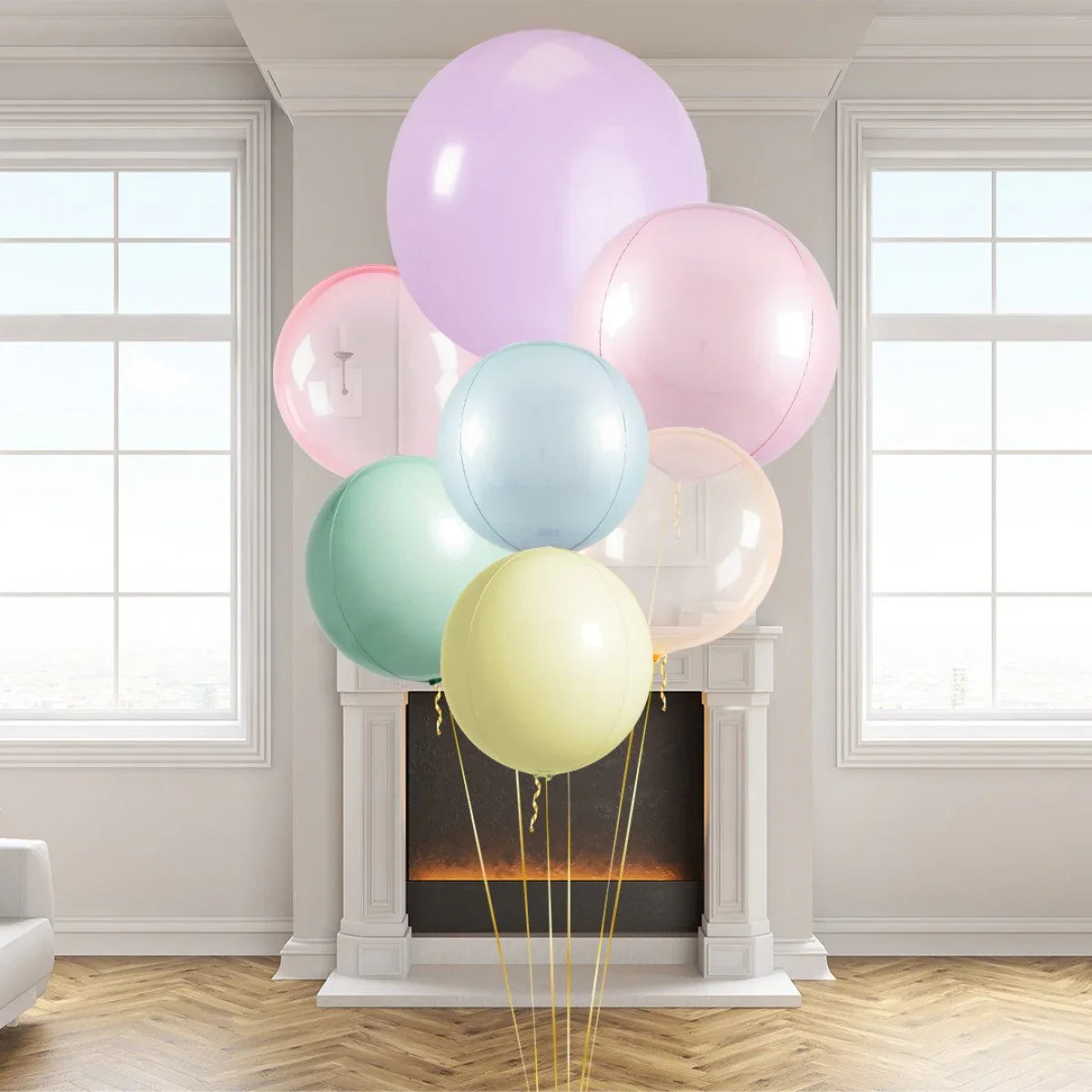 Cluster of pastel giant helium balloons in living room with fireplace and large windows
