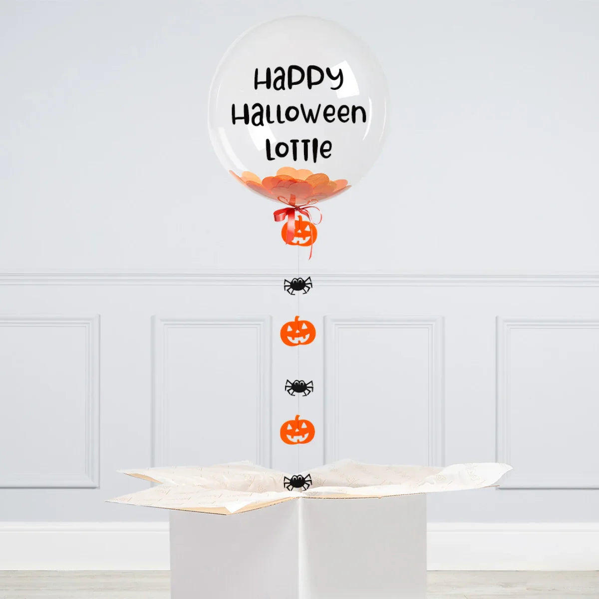 Personalized clear Halloween balloon with orange confetti, spiders, pumpkins, and 'Happy Halloween Lottie' text
