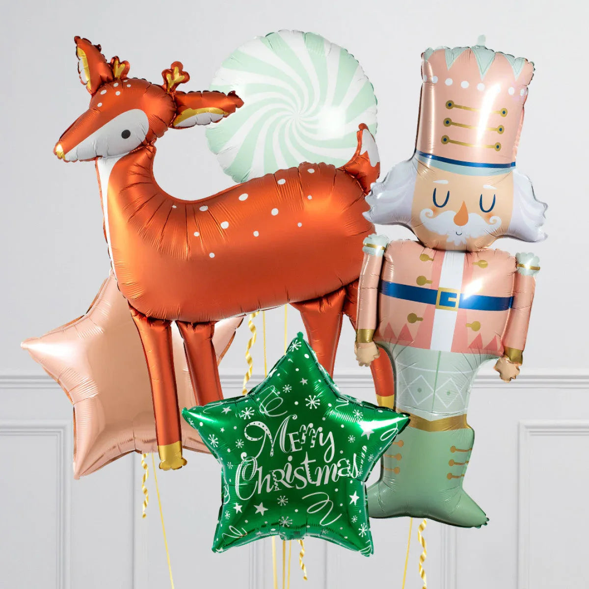 Christmas balloons including a reindeer, nutcracker, peppermint, and star with Merry Christmas text