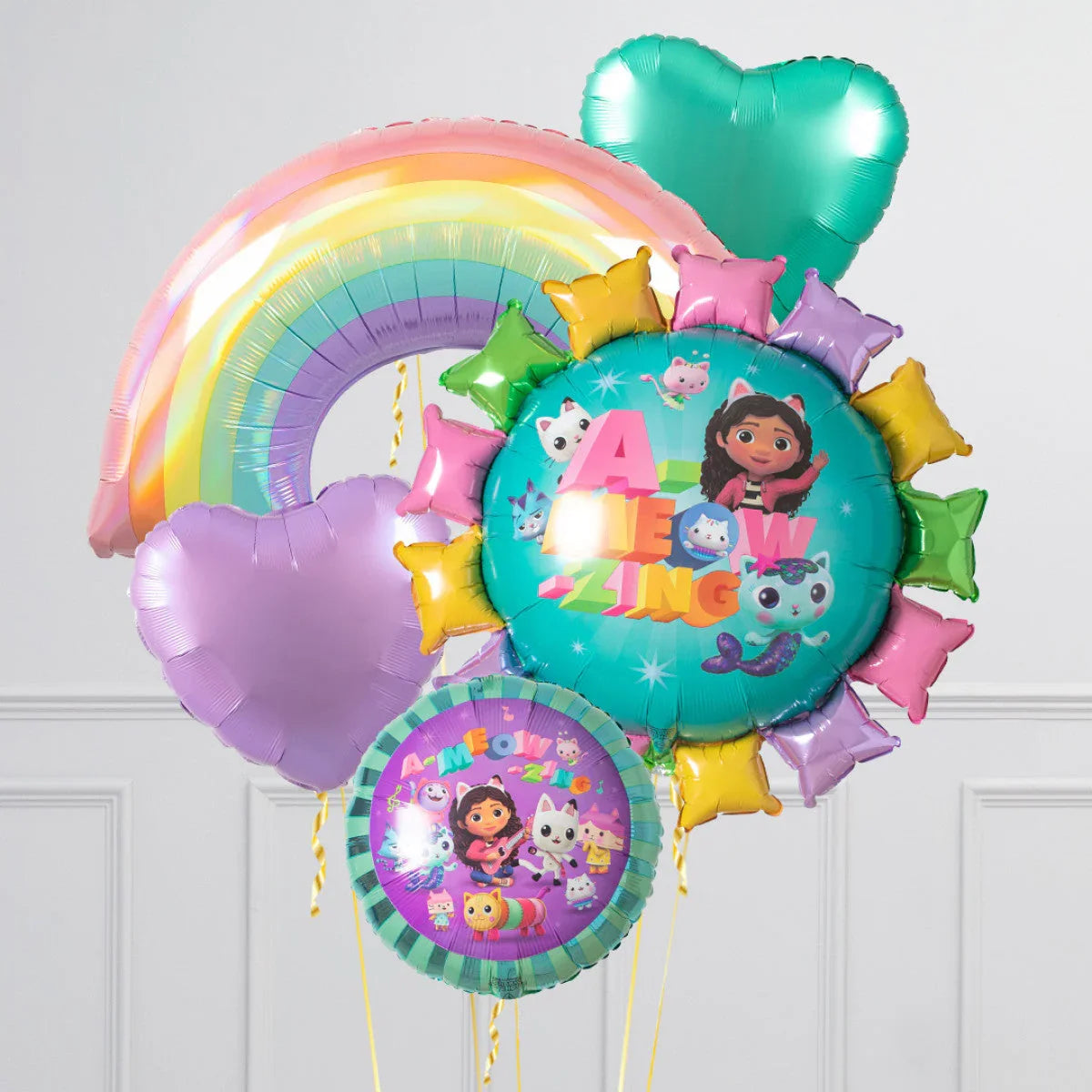 Colorful Dora the Explorer themed birthday balloons including rainbow, hearts, and character print balloons