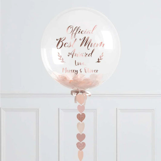 Clear balloon with rose gold text "Official Best Mum Award" and pink heart decorations