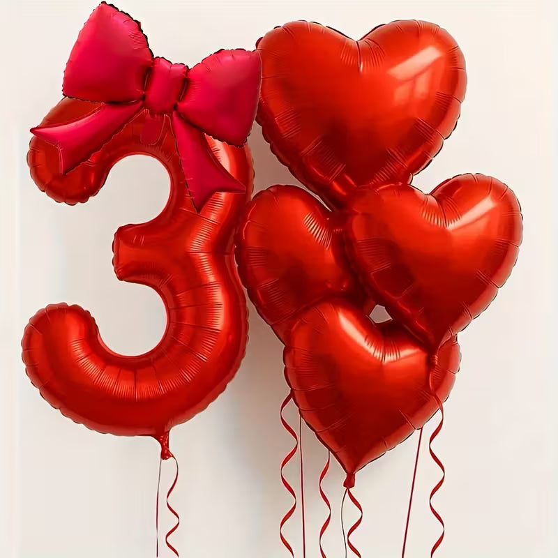Red number 3 foil balloon with a pink bow and four red heart-shaped foil balloons