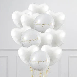 White heart and round balloons with gold Congrats text for elegant engagement celebration