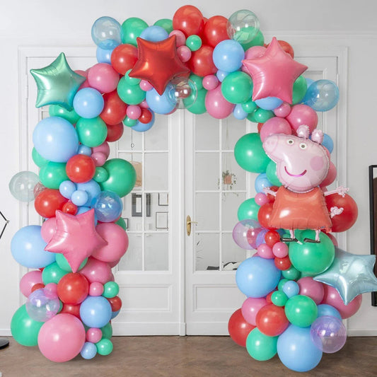 Colorful balloon arch with Peppa Pig foil balloon and star-shaped balloons indoors