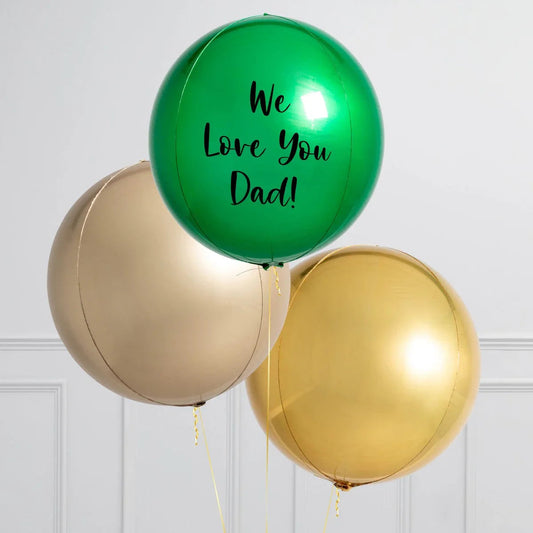 Personalised emerald green orb balloon with 'We Love You Dad!' message and two metallic gold balloons