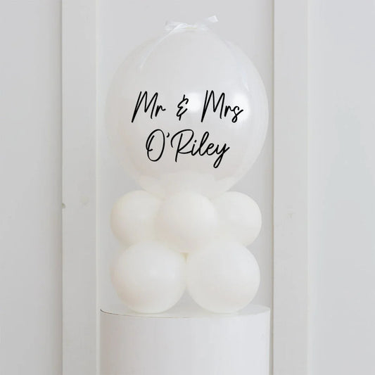 White personalised Mr & Mrs O'Riley bubble balloon decoration on white balloon base