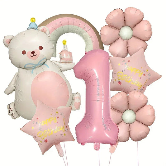 Pink and cream bear-shaped birthday balloon holding cake with rainbow, large pink number 1, pink flowers, and star balloons with Happy Birthday text