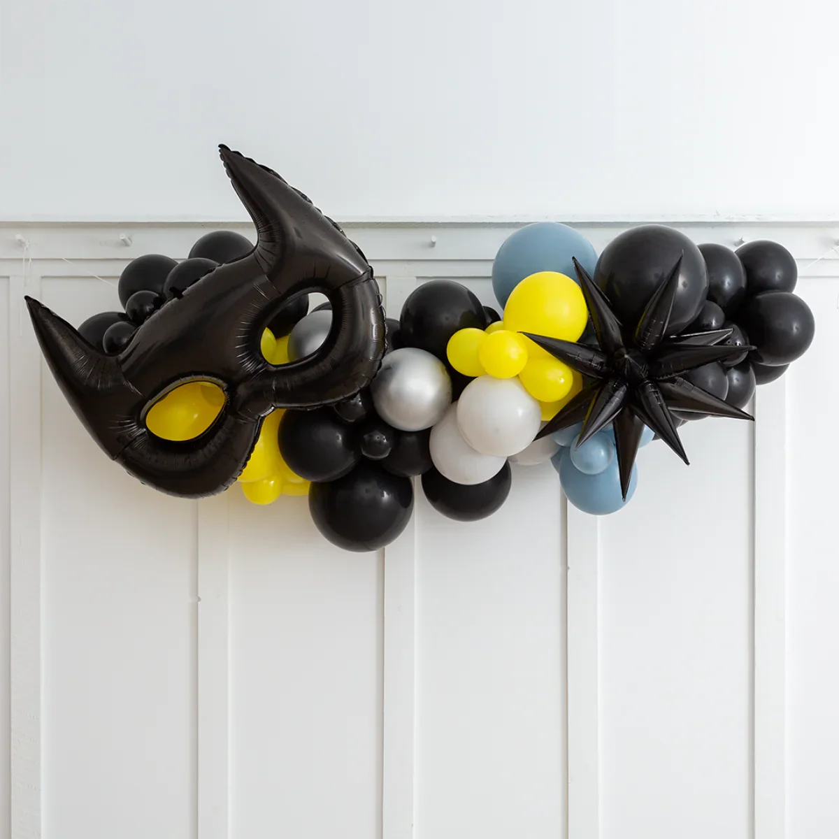  Batman party balloon garland with black mask and black spiked foil balloons in yellow, black, white, blue colors