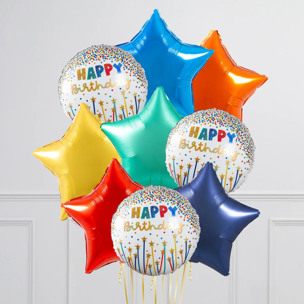 Colorful birthday foil balloons including stars and round Happy Birthday designs on white background