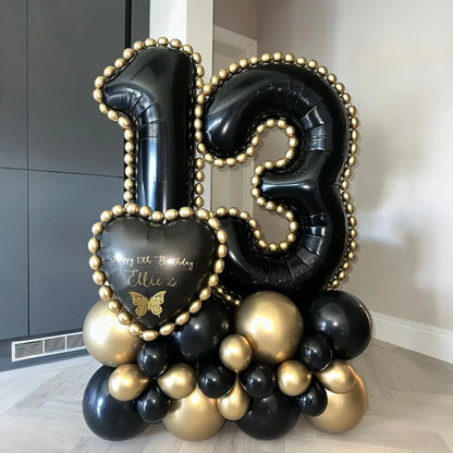 Black and gold balloon arrangement with large number 13 and heart-shaped balloon reading Happy 13th Birthday Ellie x