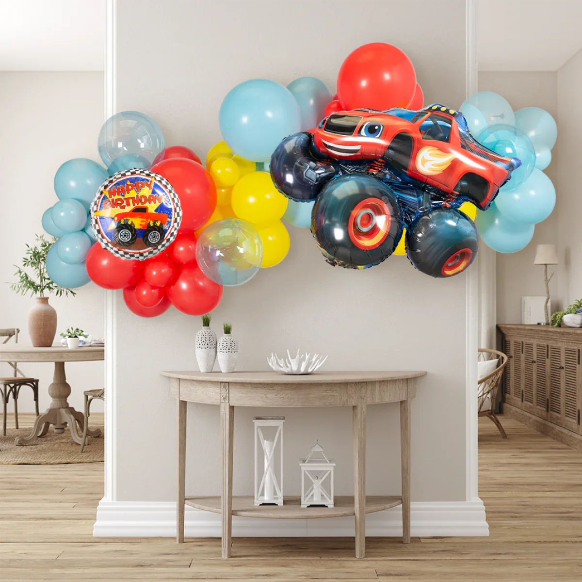 Colorful birthday balloon garland with red monster truck balloon in modern living room