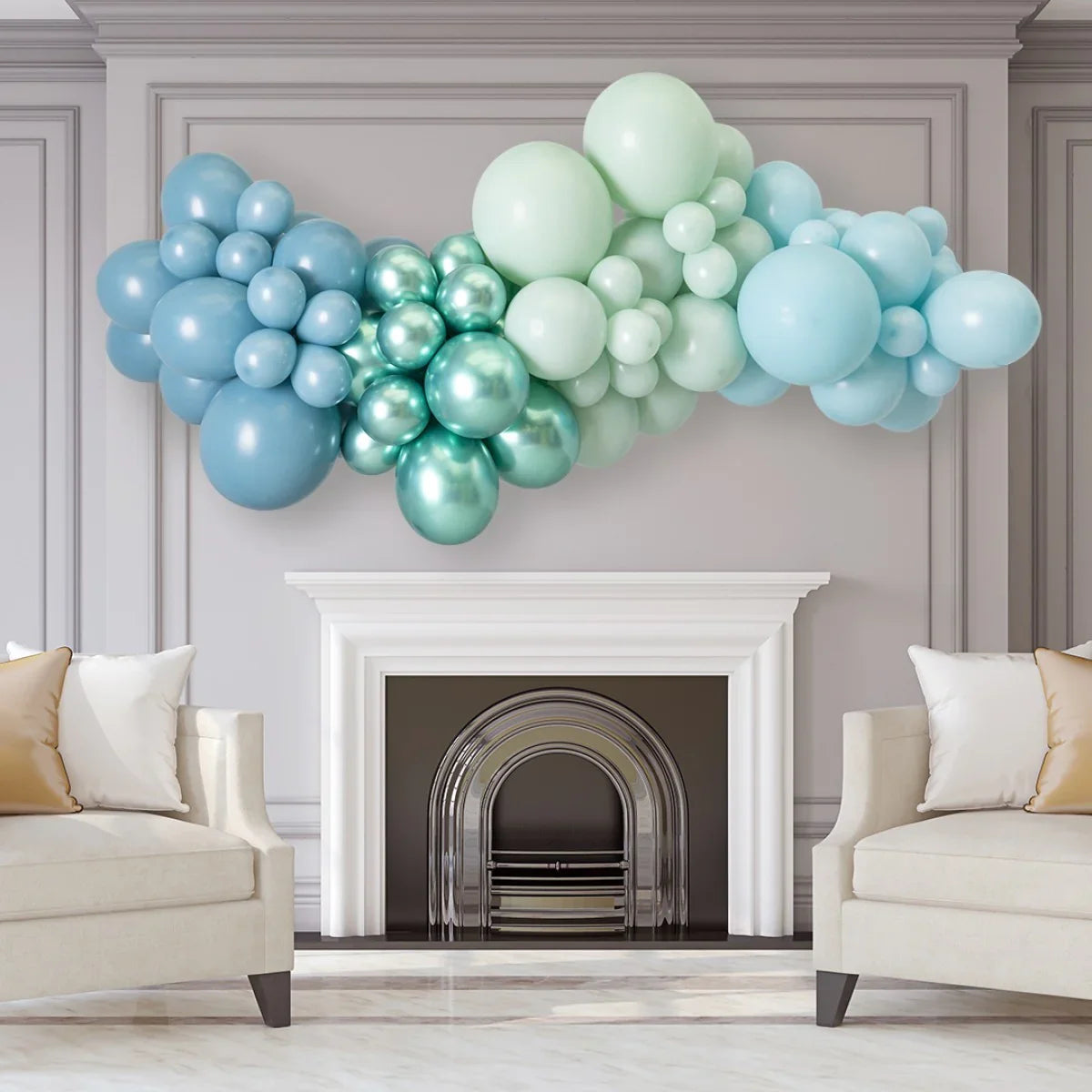 Blue and teal balloon garland above white fireplace in elegant living room with beige chairs
