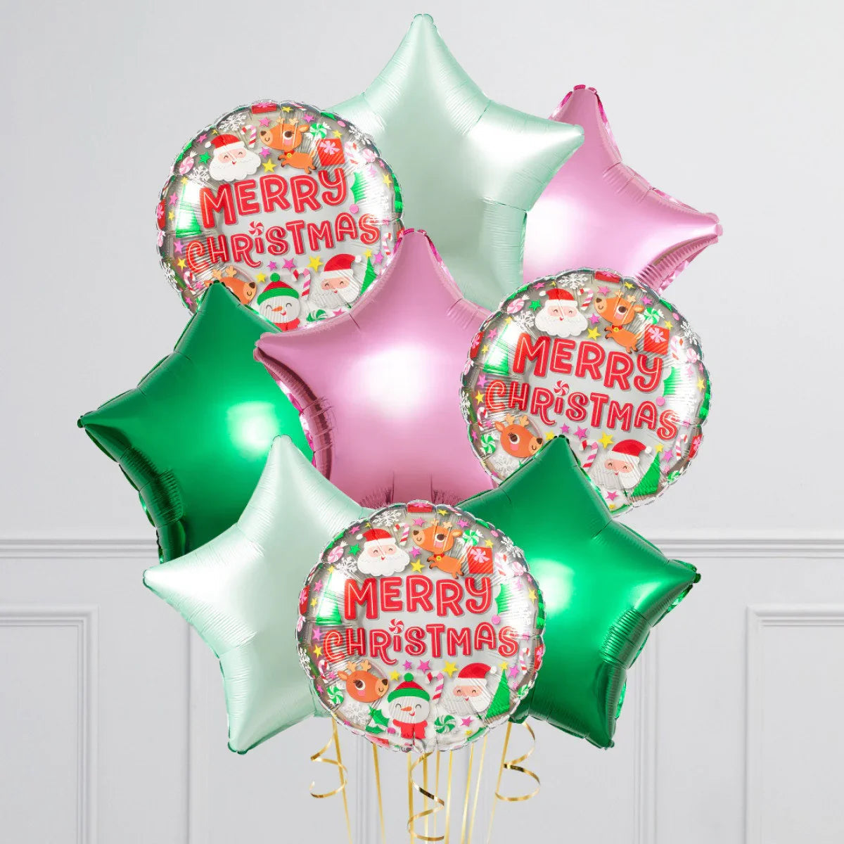 Festive Christmas balloons in green, pink, and light blue stars with Merry Christmas foil balloon featuring Santa and reindeer