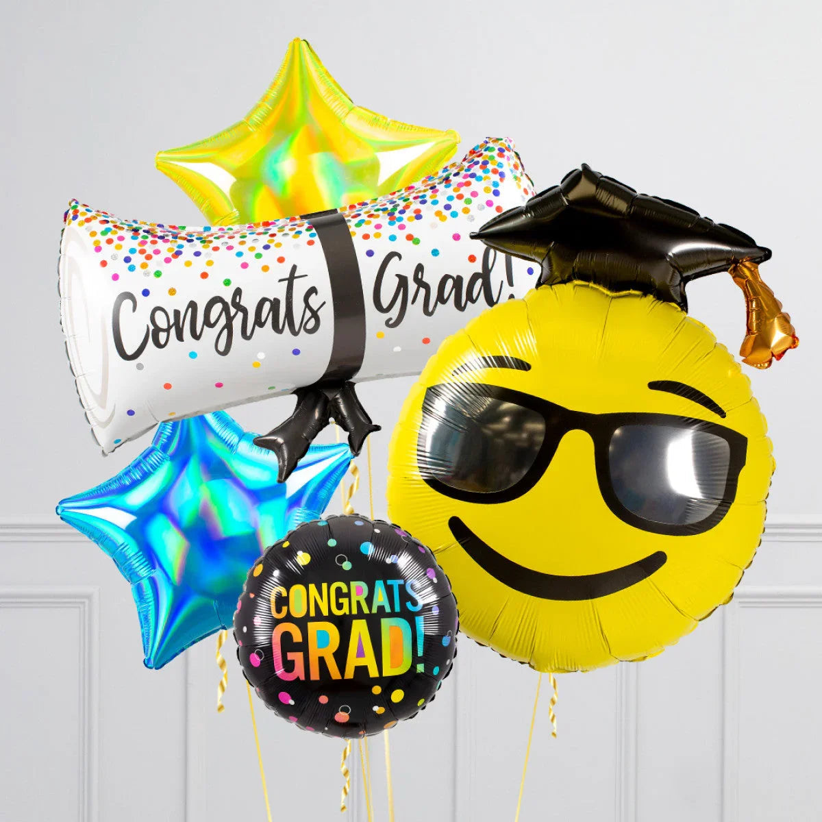 Colorful grad balloons including Congrats Grad message, smiley emoji with cap, and star shapes
