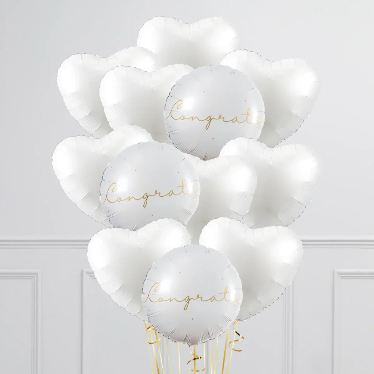White heart-shaped and round foil balloons with gold 'Congrats' text for celebration decor