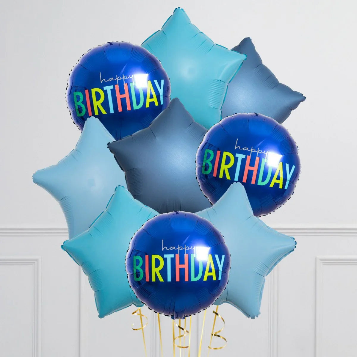 Blue star-shaped and round foil balloons with colorful Happy Birthday text on white background