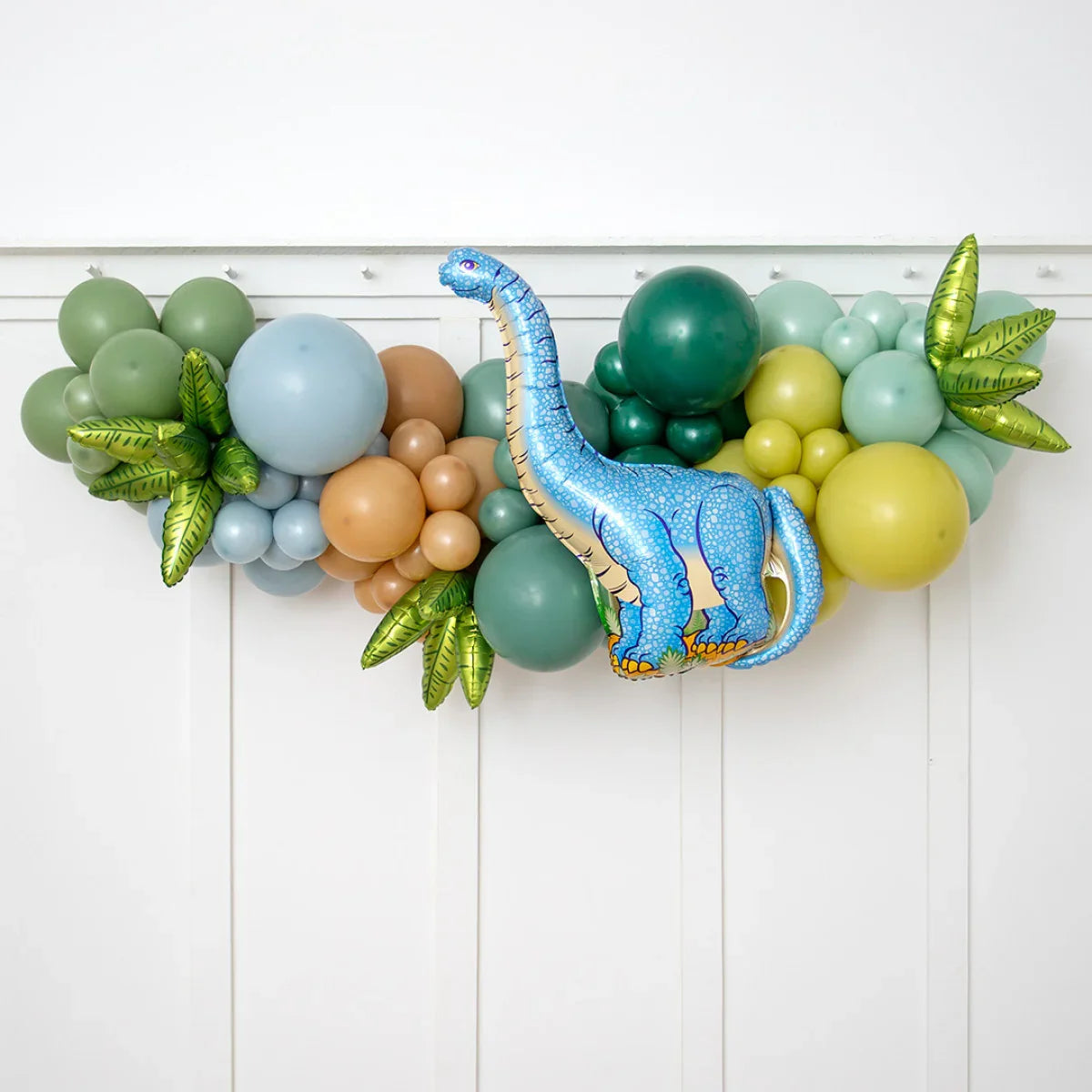 Colorful dinosaur balloon garland with blue inflatable dino and green, yellow, brown balloons