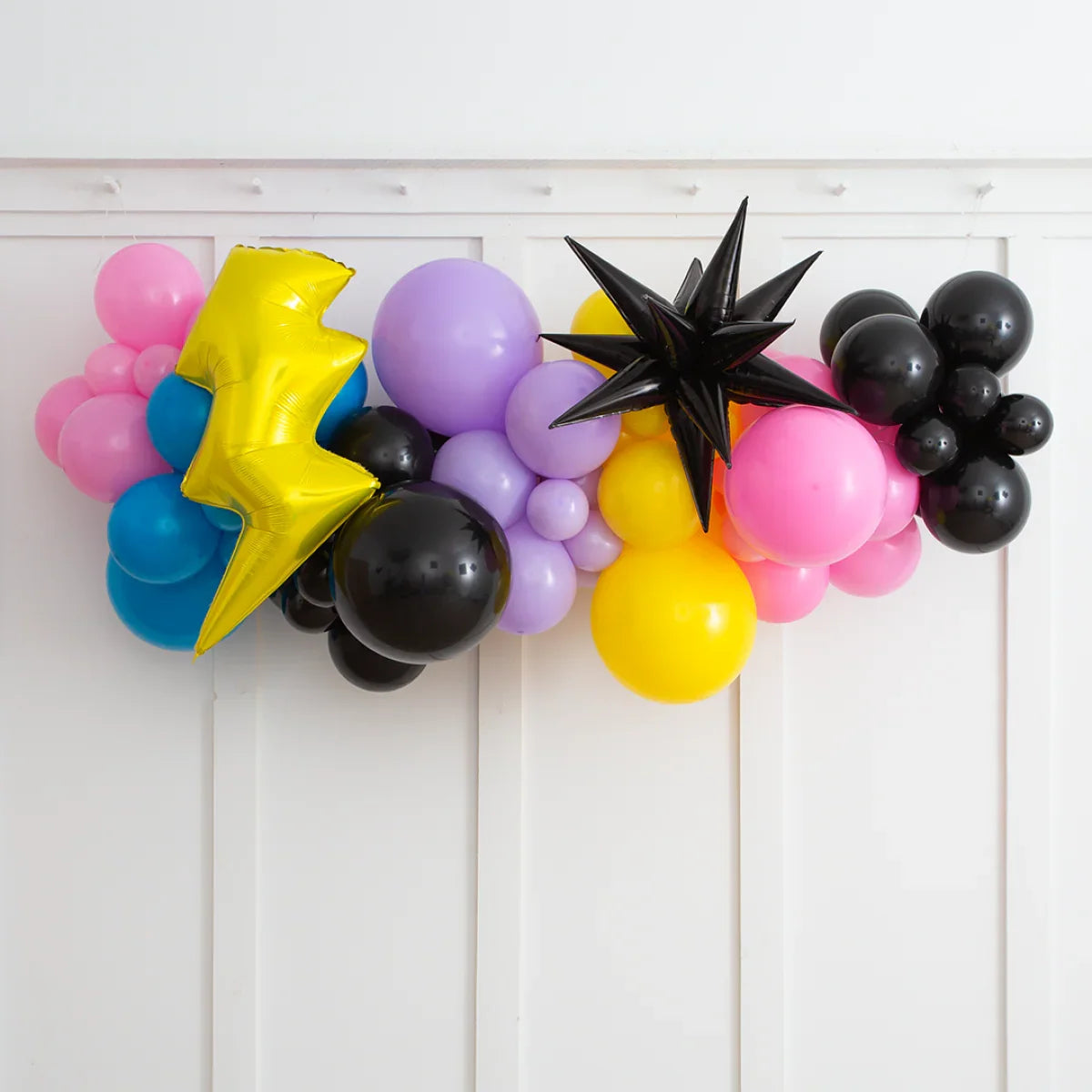 Colorful 2m balloon garland with pink, purple, yellow, blue, black balloons and black star and yellow lightning foil
