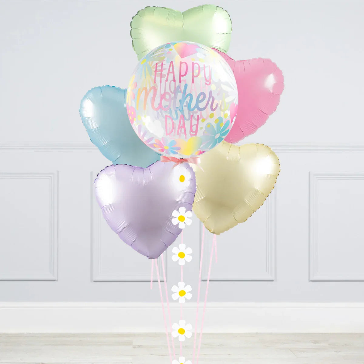 Pastel heart-shaped balloons and a large transparent balloon with Happy Mother's Day text and floral design