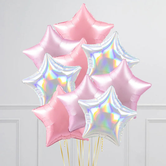 Bunch of iridescent, pink, and lilac star-shaped inflated foil balloons with gold strings