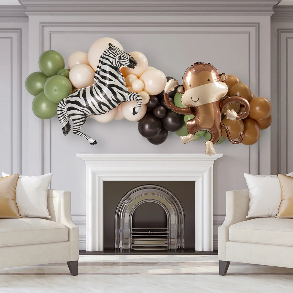 Jungle party balloon garland with zebra and monkey foil balloons over white fireplace in living room