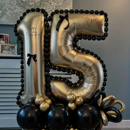 Gold and black balloon arrangement in numbers 1 and 5 for 15th birthday celebration with black bows