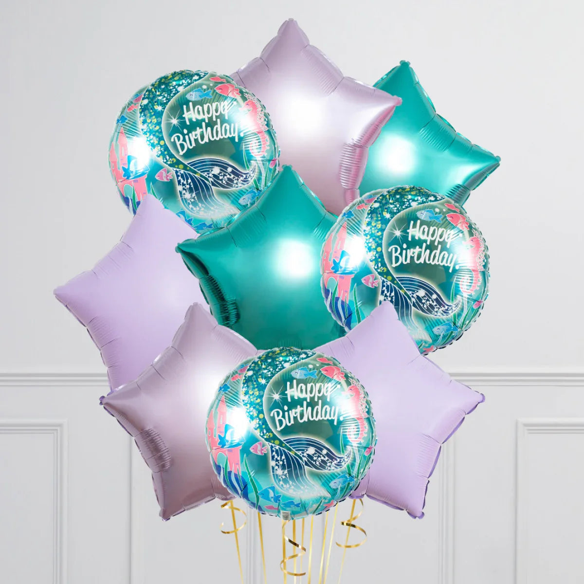 Turquoise and lavender star-shaped and mermaid-themed Happy Birthday foil balloon bunch
