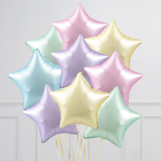Pastel rainbow star-shaped satin foil balloons bouquet on white background