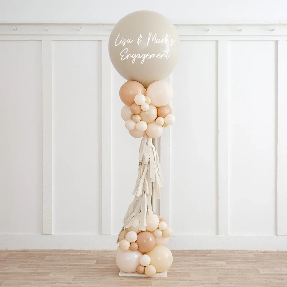 Personalised neutral beige balloon decoration with tassels and cluster, for Lisa & Mark's engagement
