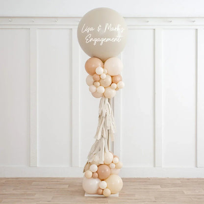 Personalised neutral beige balloon decoration with tassels and cluster, for Lisa & Mark's engagement