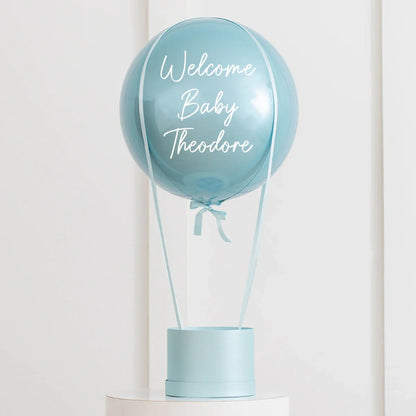 Personalized baby blue hot air balloon decoration with Welcome Baby Theodore text