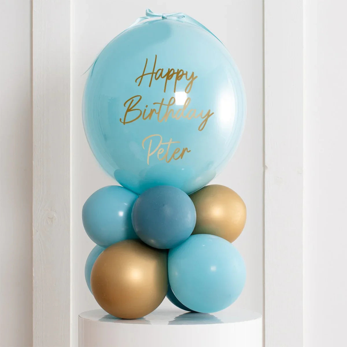 Personalised blue and gold birthday balloon stack with Happy Birthday Peter text