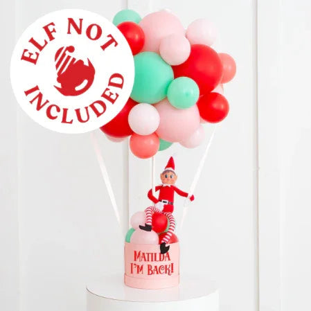 Personalized hot air balloon with red, green, pink balloons and elf figure, text Matilda I'm Back