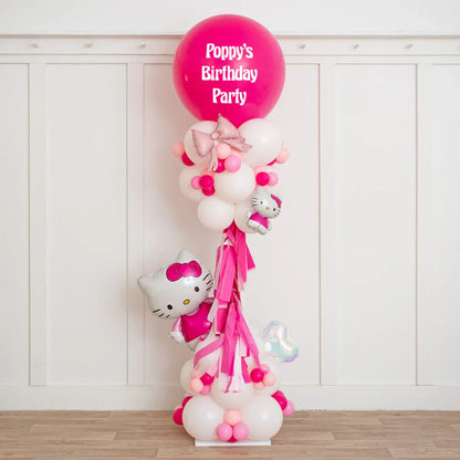Personalized pink and white Hello Kitty balloon pillar with birthday message and ribbons