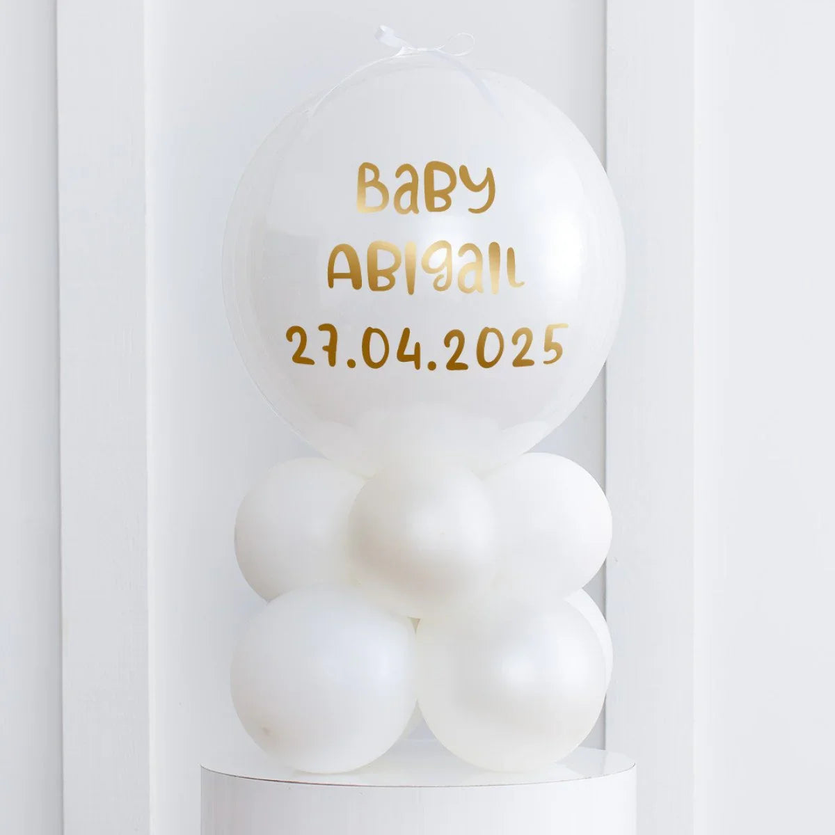 Personalised pearl white air-filled balloon stack for baby Abigail with date 27.04.2025