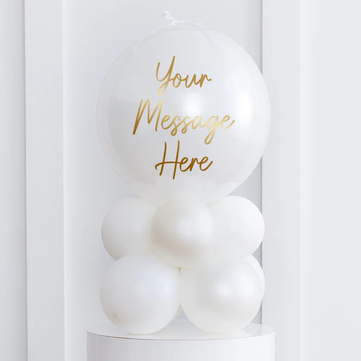 Personalised pearl white air-filled bubble balloon stack with customizable gold message on top balloon