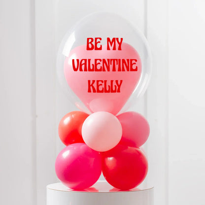 Personalized Valentine heart balloon inside clear bubble with red text and colorful balloon base